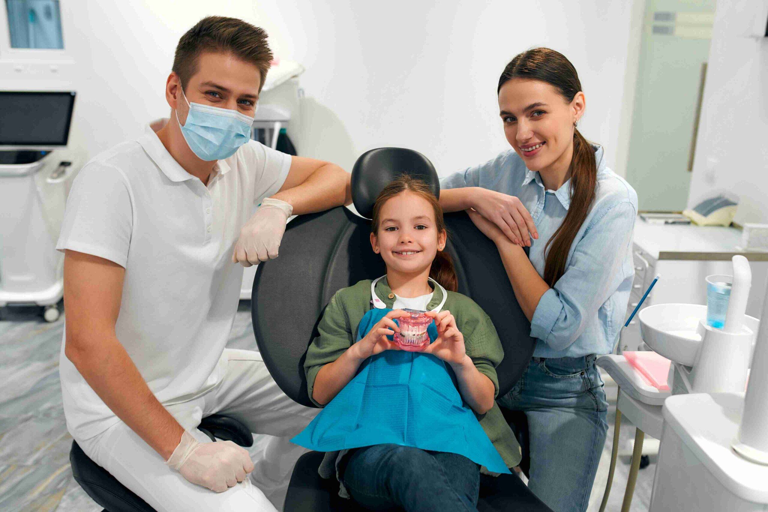 Family smiling together at the dental office.