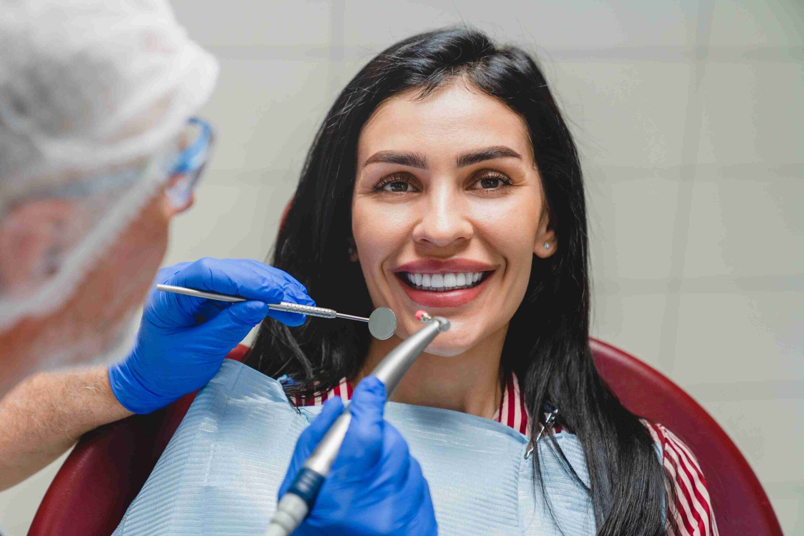 Patient smiling during a dental checkup.